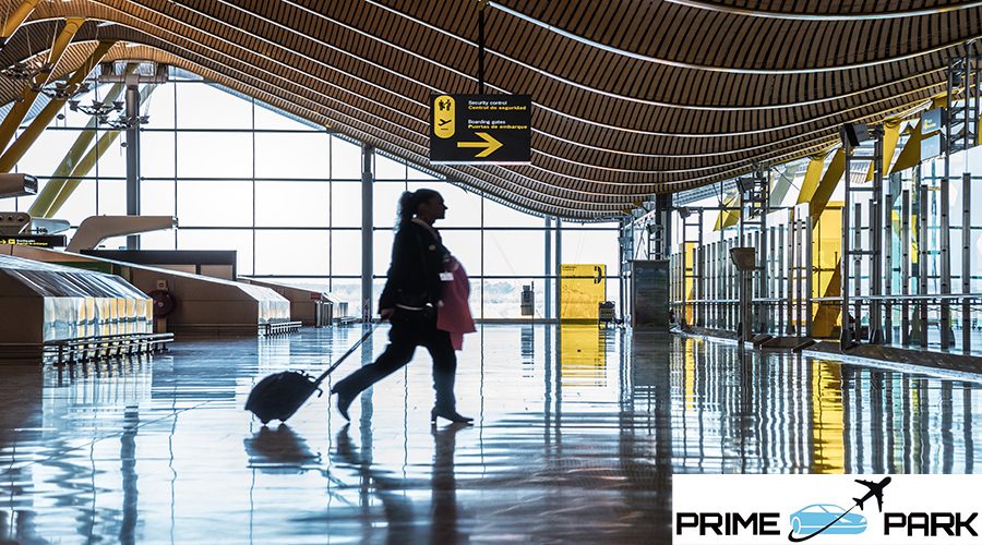 airport terminal with people moving silhouettes and sun-ray