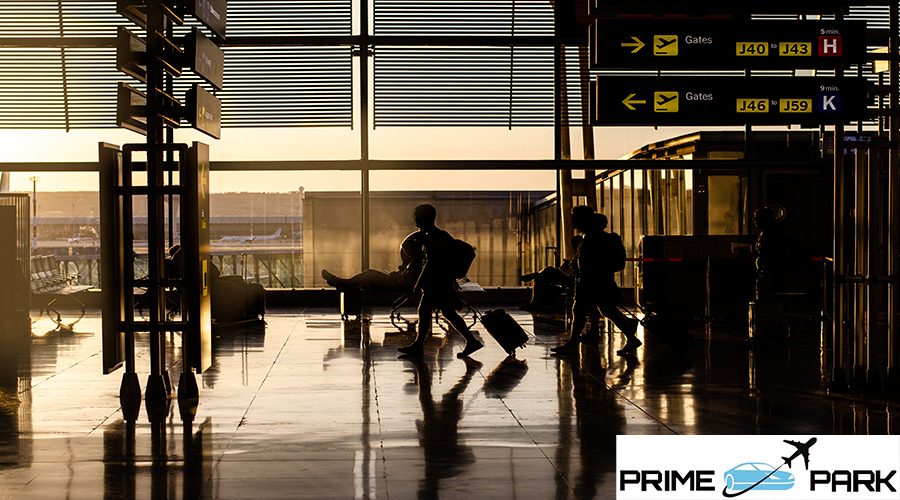 Silhouette of people walking inside a airport terminal