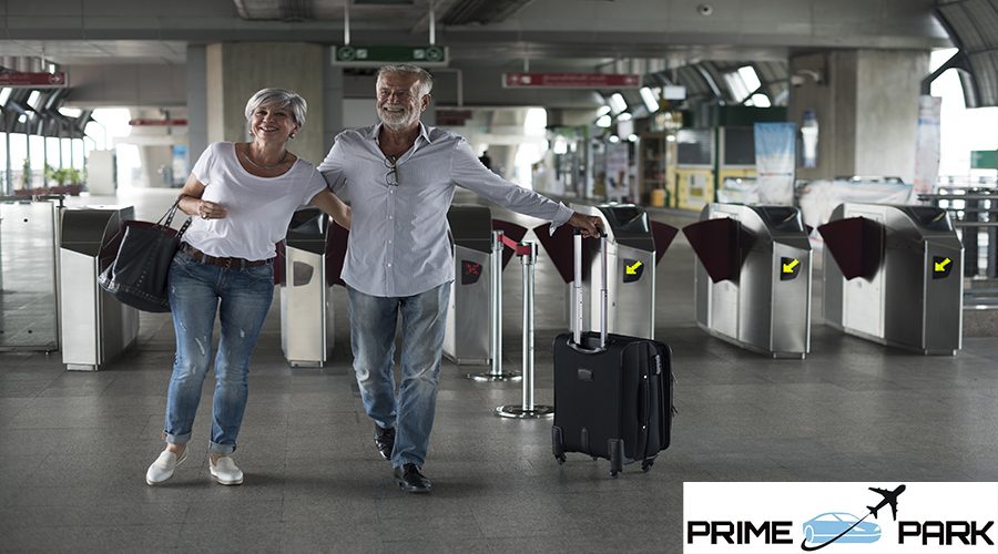 Senior couple traveling train ticket gate