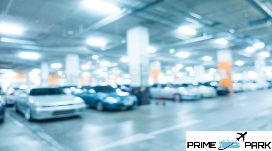 Abstract blur car parking in shopping mall for background - Blue white balance processing