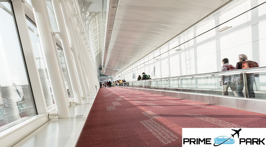 Blur of passengers walking in airport walkway