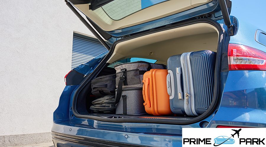 Full car trunk packed with suitcases, backpacks and bags. Vehicle filled with luggage ready for travel. Moving or road trip concept