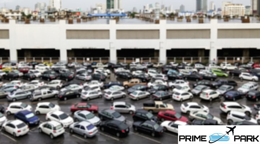 Full car park in front of the urban building with blur focus.