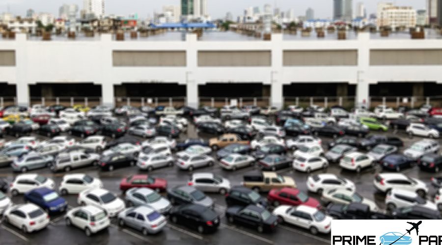 Full car park in front of the urban building with blur focus.