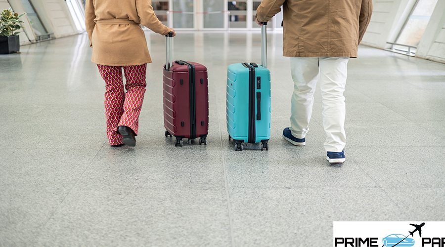 unrecognizable Senior couple walking through the bustling airport terminal, pulling their trolley suitcases, filled with excitement and anticipation for their upcoming vacation adventure