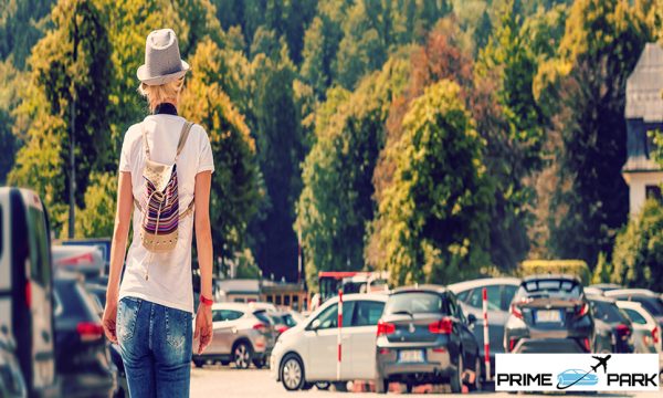 woman walking with car keys in the underground parking of the castle